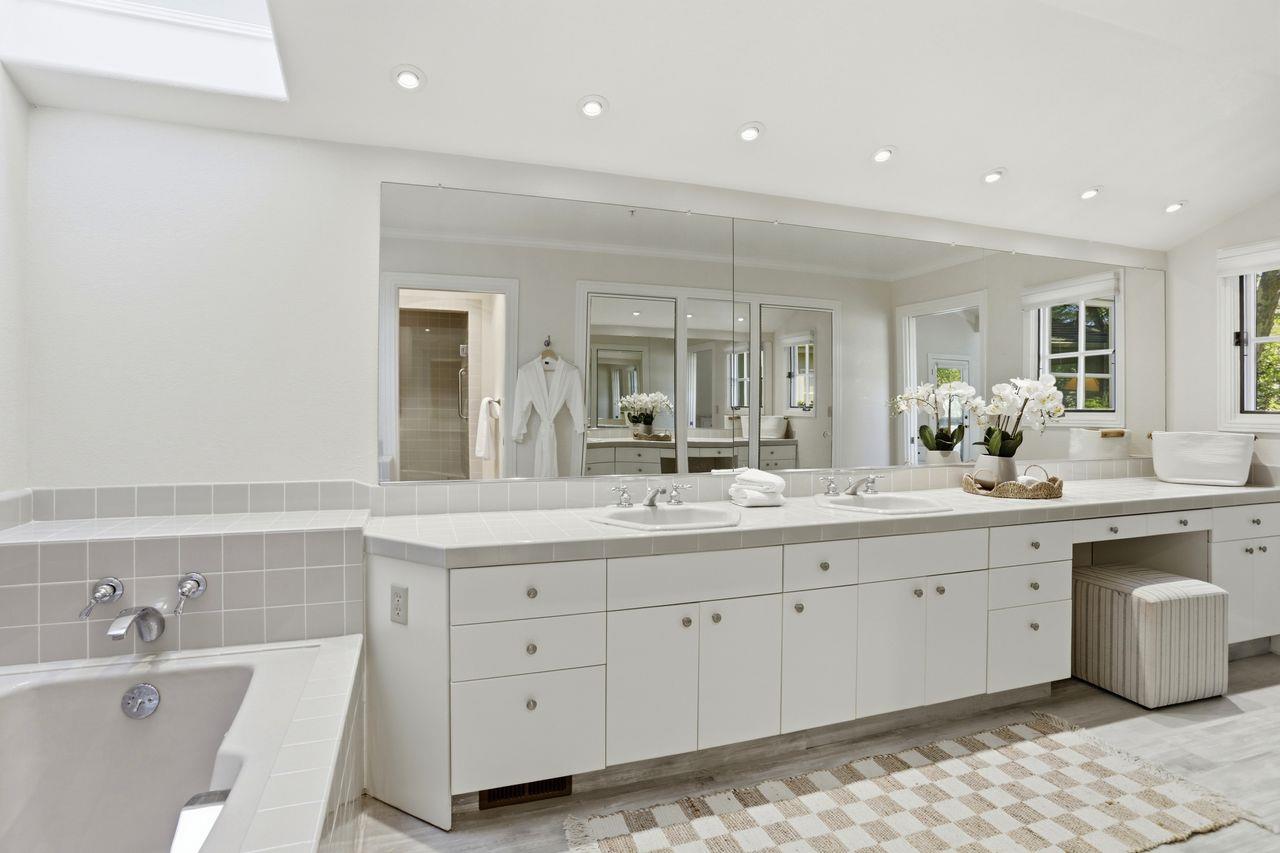 25381 Markham Lane Salinas, CA 93908 - Photo 27 of 47 a bathroom with a double vanity sink and a mirror