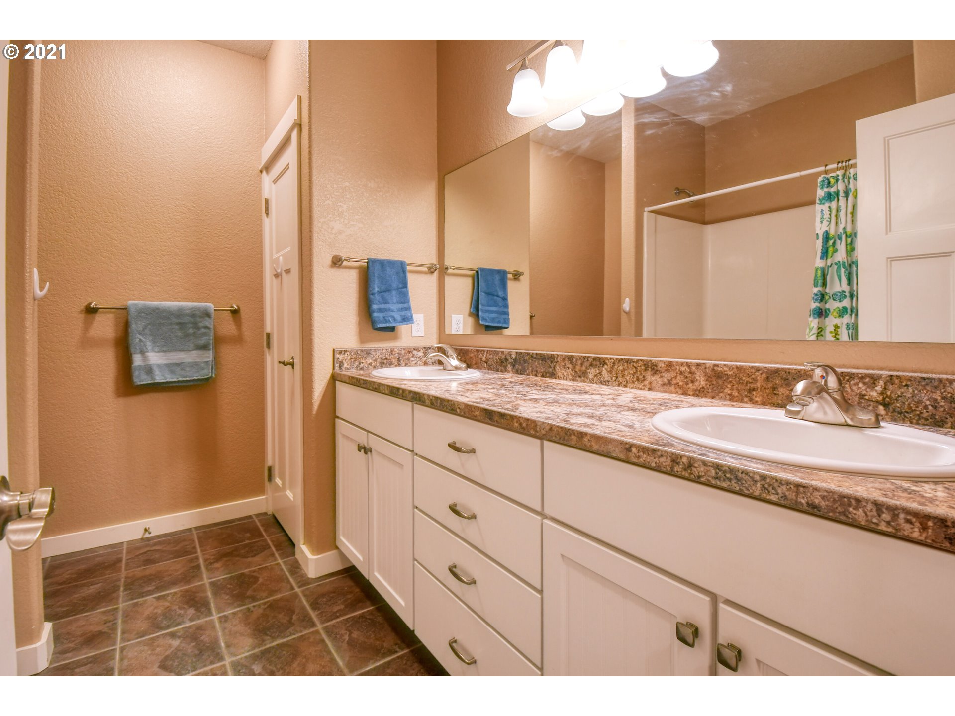 3237 Southwest Hailey Avenue Pendleton, OR 97801 - Photo 22 of 29 a bathroom with a granite countertop sink and a mirror