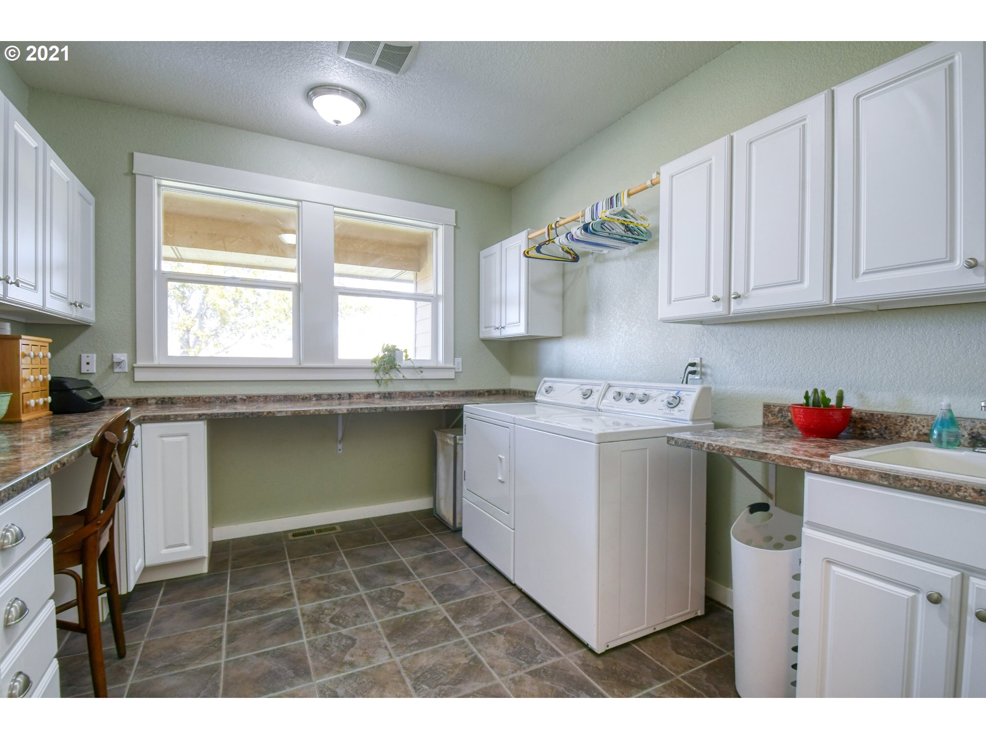 3237 Southwest Hailey Avenue Pendleton, OR 97801 - Photo 24 of 29 a kitchen with a sink cabinets and window