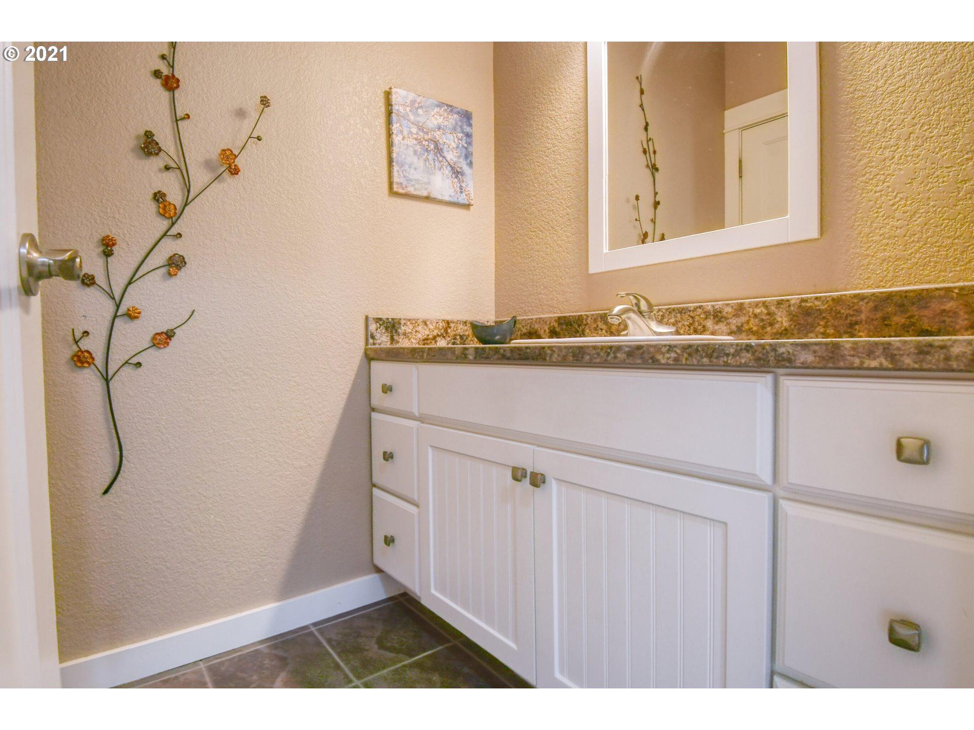 3237 Southwest Hailey Avenue Pendleton, OR 97801 - Photo 25 of 29 a bathroom with a granite countertop sink and a mirror