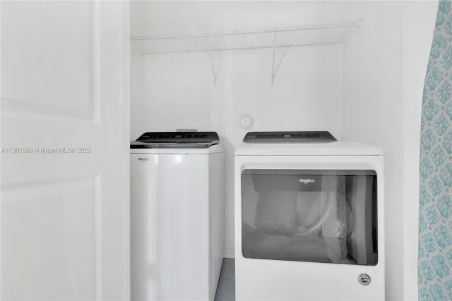 a utility room with dryer and washer