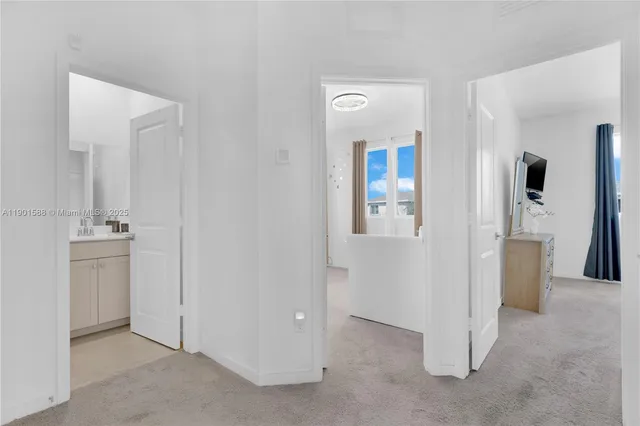 wooden floor with white cabinets
