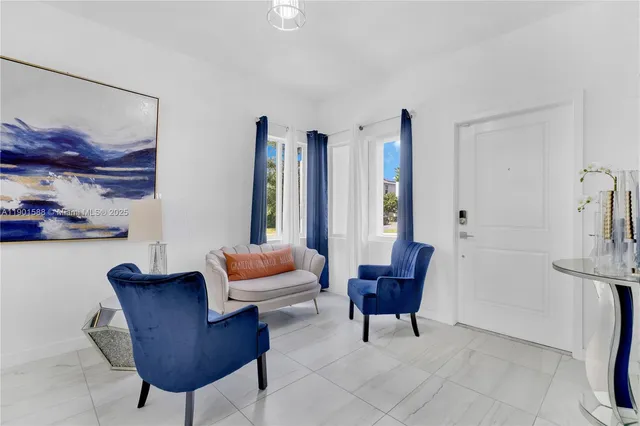 a living room with furniture and a chair