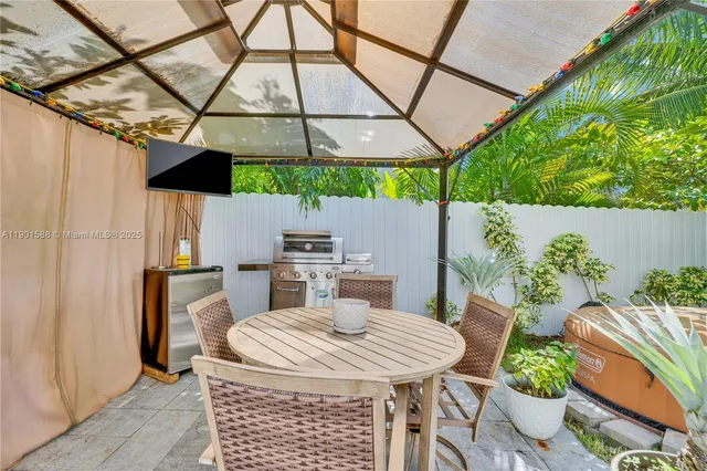 a outdoor dining space with furniture