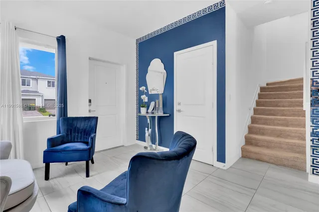 a view of entryway with livingroom and furniture