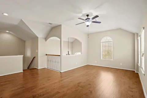 a spacious bathroom with a double vanity sink a large mirror and shower