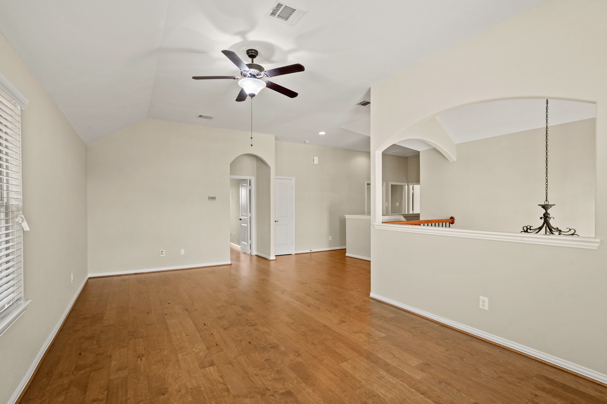 3414 Satton Ranch Lane Fulshear, TX 77441 - Photo 12 of 25 a view of a room with a sink and wooden floor