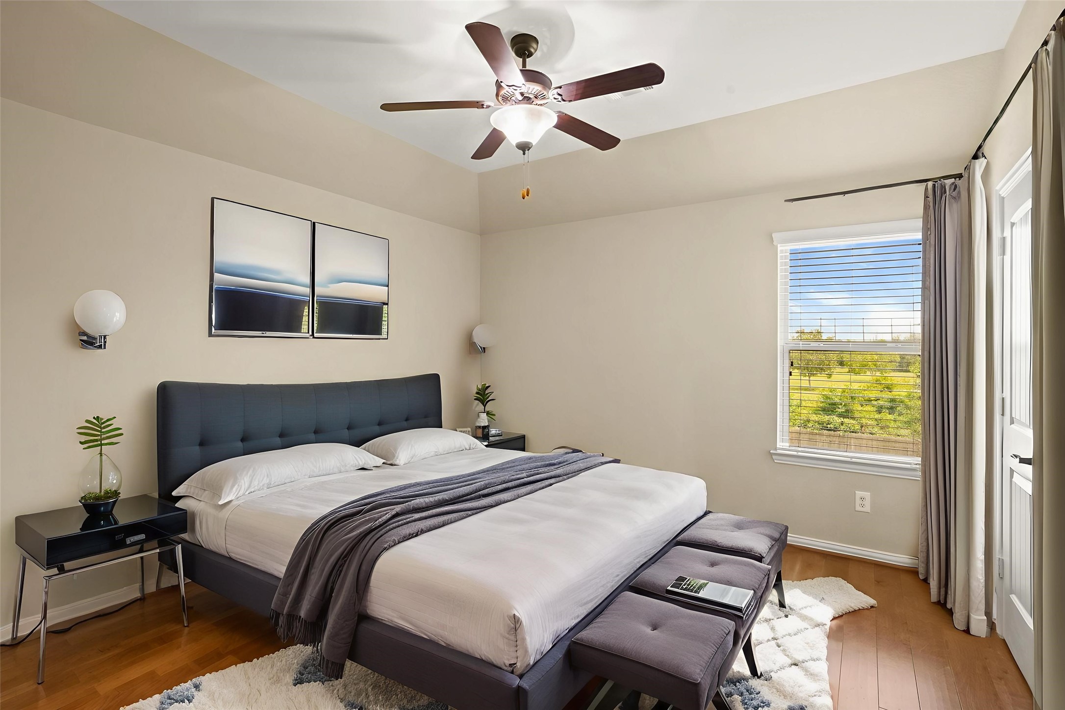 3414 Satton Ranch Lane Fulshear, TX 77441 - Photo 13 of 25 a bedroom with a bed and a chandelier