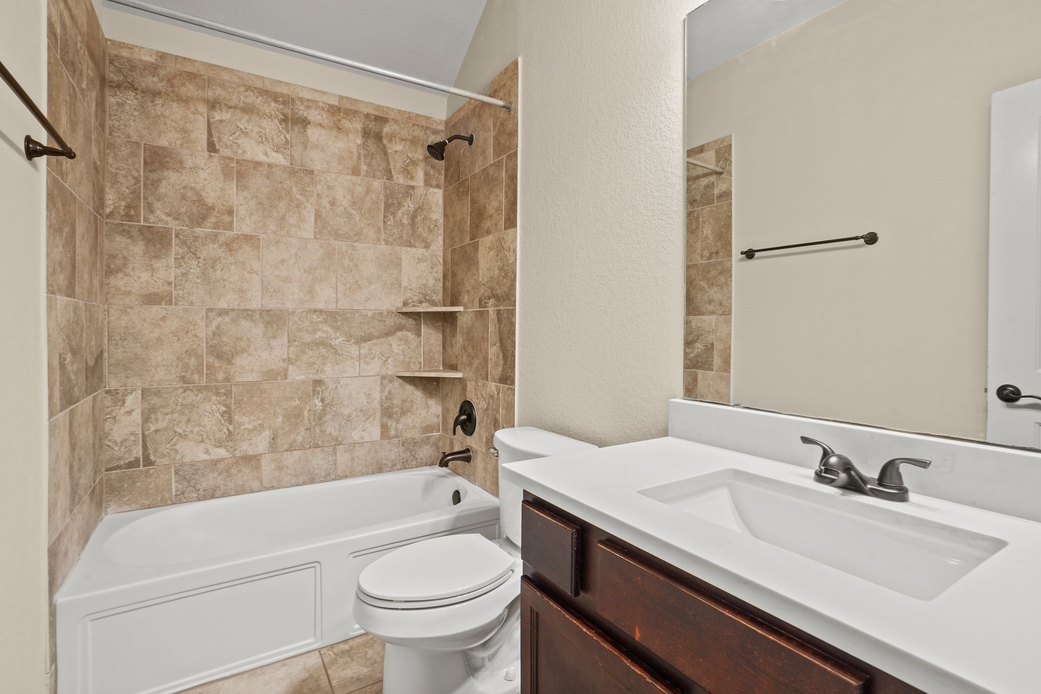 3414 Satton Ranch Lane Fulshear, TX 77441 - Photo 14 of 25 a bathroom with a sink toilet and shower
