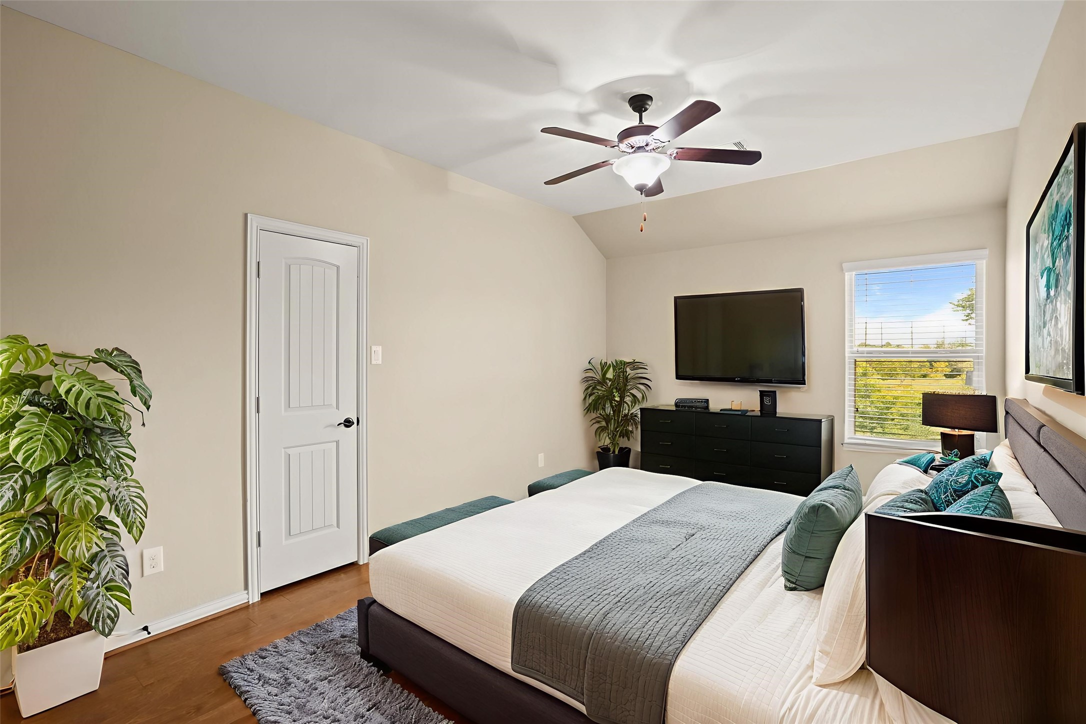 3414 Satton Ranch Lane Fulshear, TX 77441 - Photo 15 of 25 a bedroom with a bed and a flat screen tv