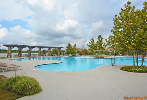 a view of a swimming pool with an outdoor seating