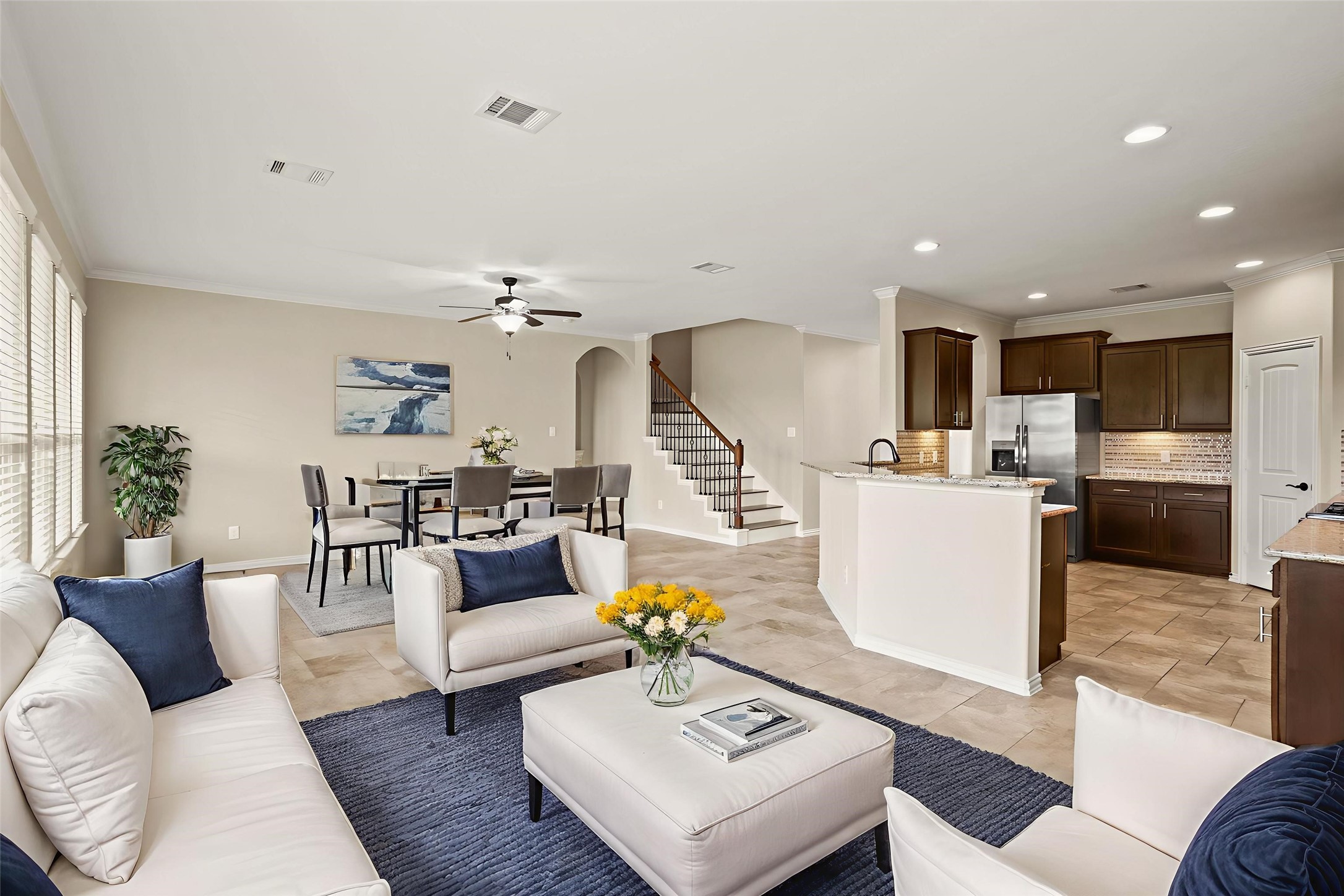 3414 Satton Ranch Lane Fulshear, TX 77441 - Photo 3 of 25 a living room with furniture and kitchen view
