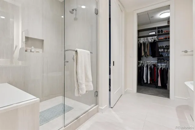 a bathroom with a bathtub and a shower