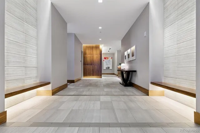 a kitchen with white cabinets and appliances