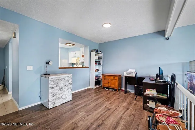 a workspace with furniture and wooden floor