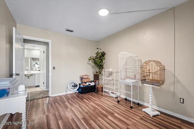 a view of livingroom with furniture and hardwood floor