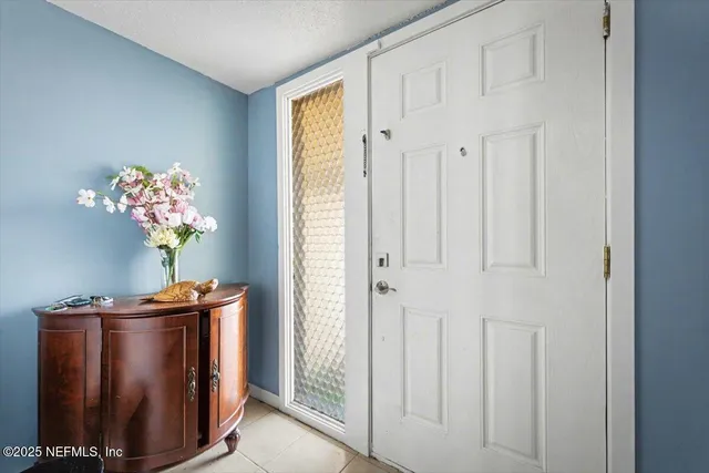 a vase of flowers sitting on a table field