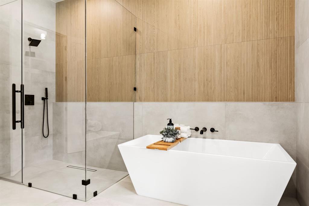 4322 Sexton Lane Dallas, TX 75229 - Photo 11 of 34 a bathroom with a white bath tub and shower