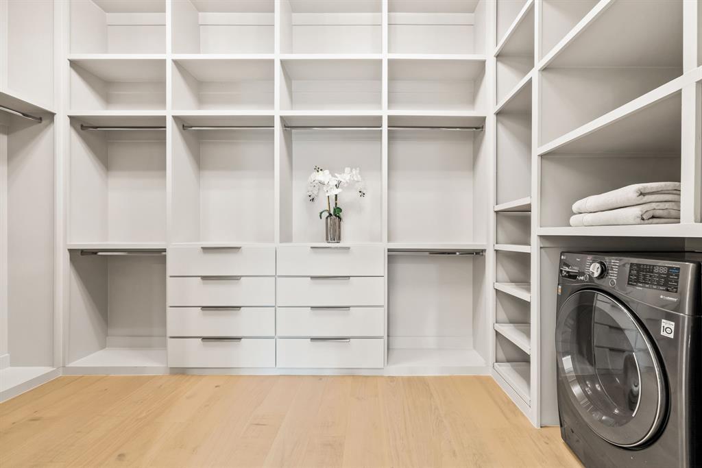 4322 Sexton Lane Dallas, TX 75229 - Photo 12 of 34 a view of walk in closet with empty racks