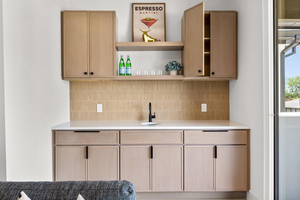 4322 Sexton Lane Dallas, TX 75229 - Photo 16 of 34 a kitchen with stainless steel appliances a sink and cabinets