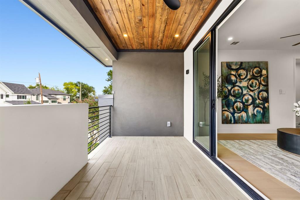 4322 Sexton Lane Dallas, TX 75229 - Photo 17 of 34 a view of a hallway with wooden floor and entryway
