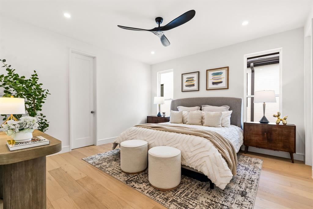 4322 Sexton Lane Dallas, TX 75229 - Photo 20 of 34 a bedroom with a bed and a table