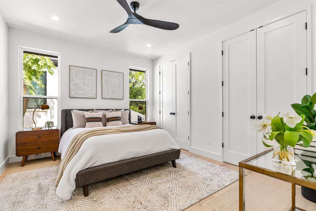 4322 Sexton Lane Dallas, TX 75229 - Photo 22 of 34 a bedroom with a bed a dresser and a window
