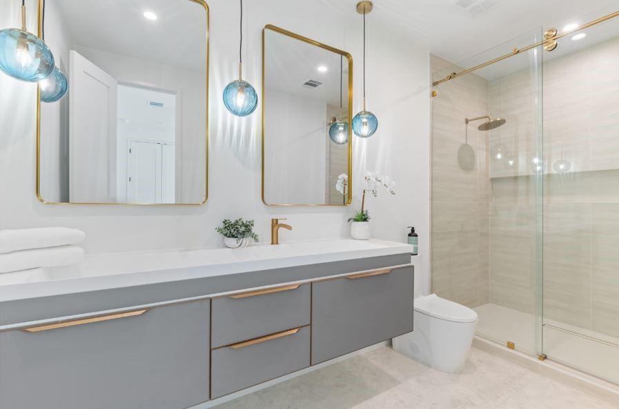 4322 Sexton Lane Dallas, TX 75229 - Photo 23 of 34 a bathroom with a double vanity sink mirror and toilet