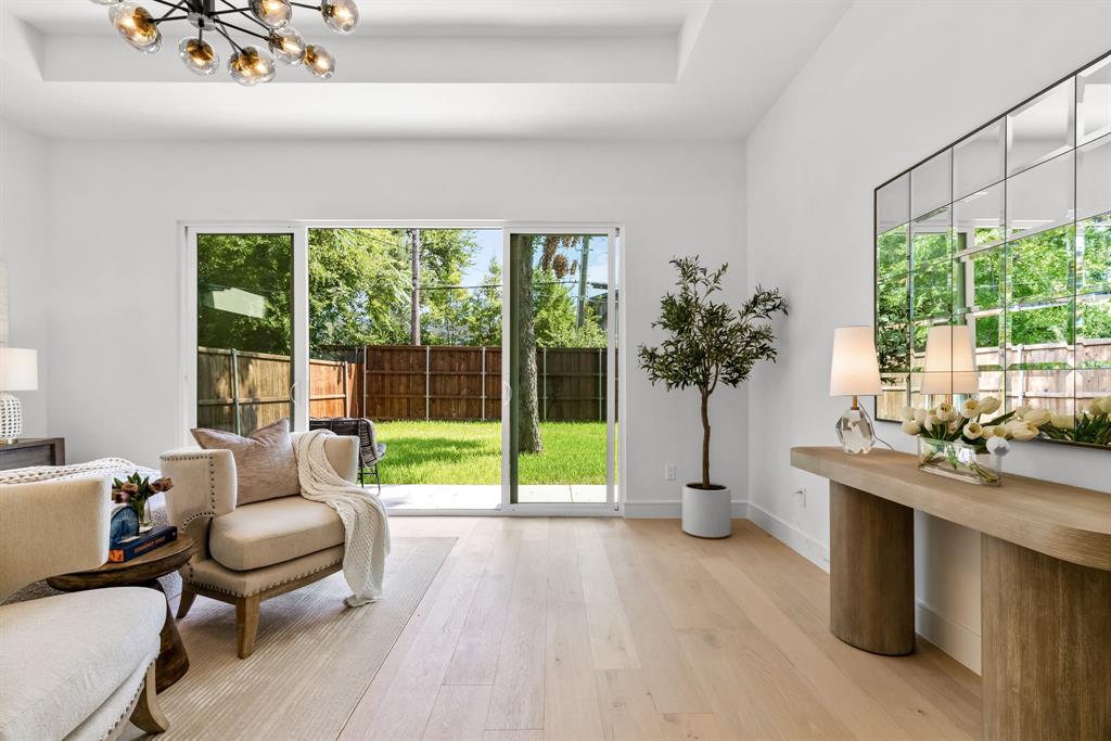 4322 Sexton Lane Dallas, TX 75229 - Photo 7 of 34 a living room with furniture and a floor to ceiling window