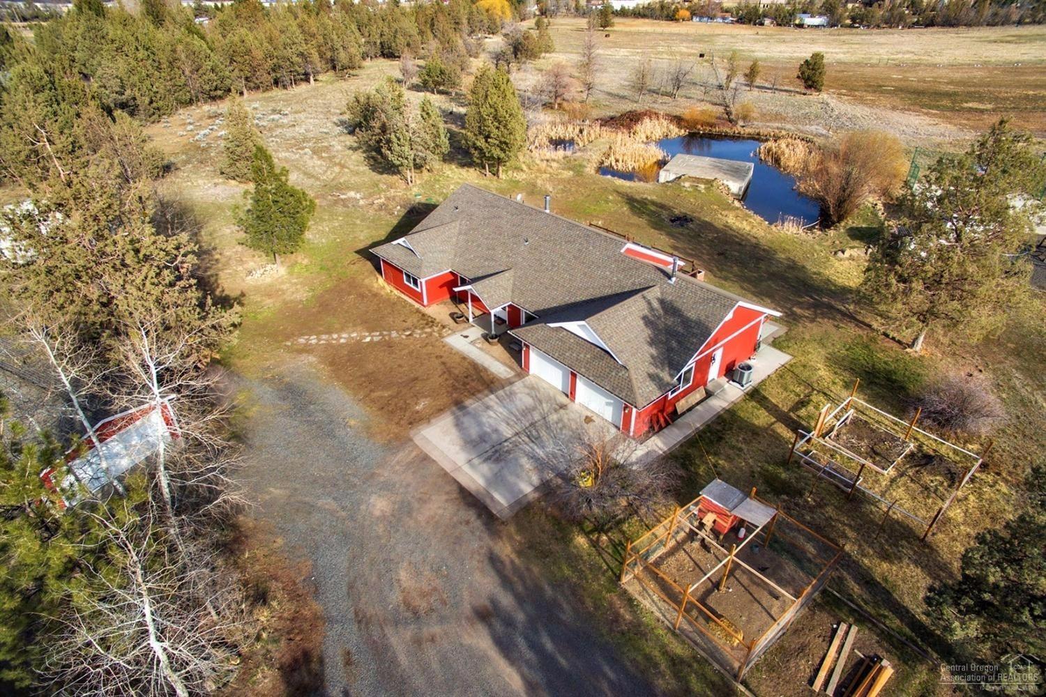 22224 Nelson Road Bend, OR 97701 - Photo 4 of 19 an aerial view of a city with lots of residential buildings