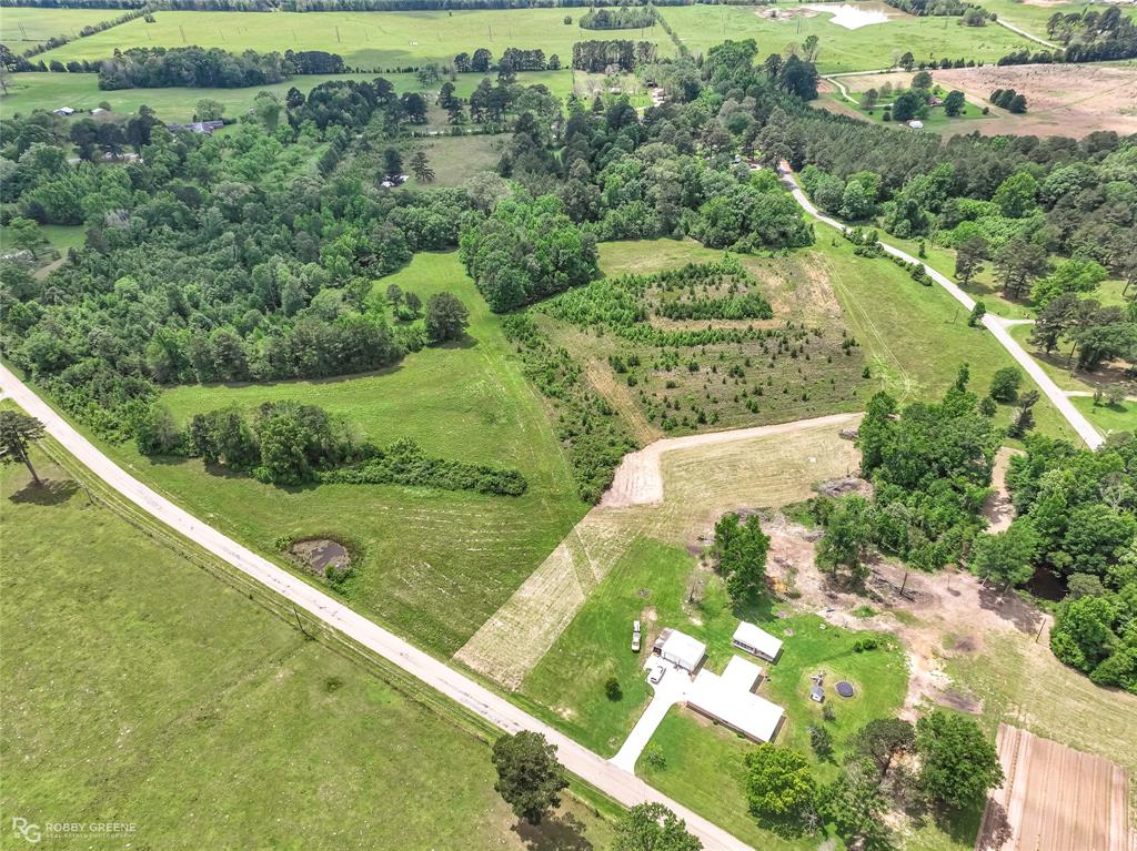 0 Percy Burns Road Springhill, LA 71075 - Photo 6 of 7 a view of a lake with a yard