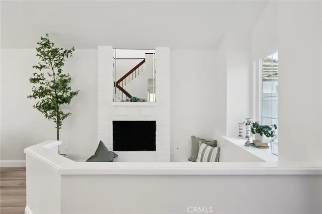 a dining room with furniture a rug and wooden floor