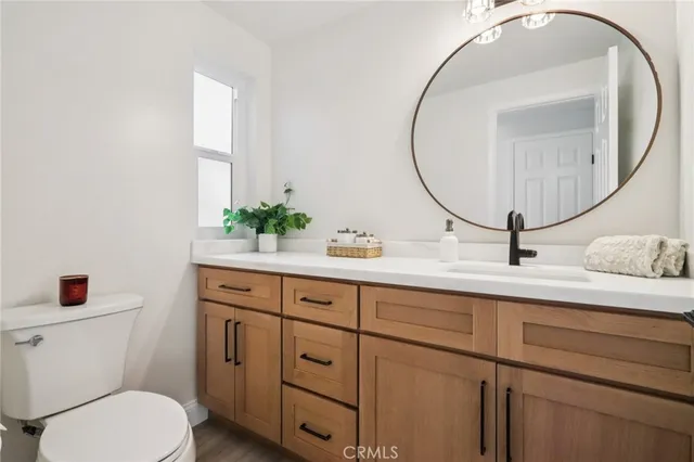 a view of a room with baby crib and hanging chair