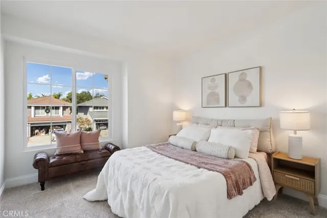 a bedroom with a bed and lamp