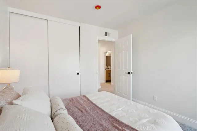 a bedroom with bed and window