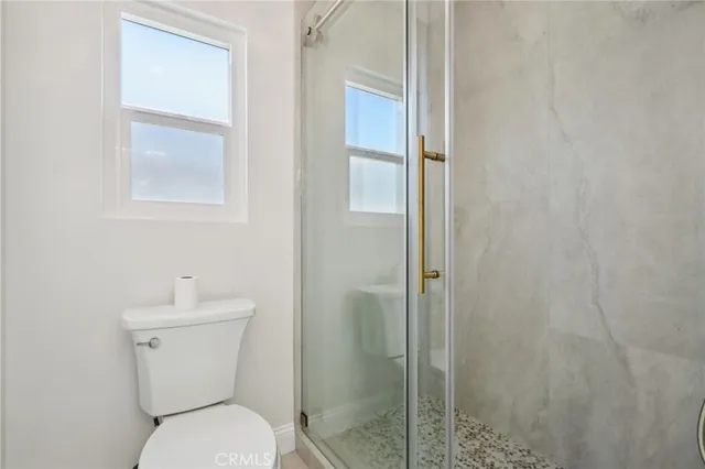 a bed room with furniture and wooden floor