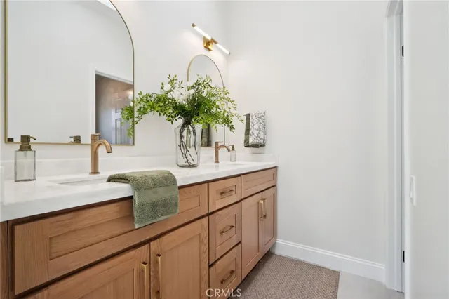 a view of patio with couches and table and chairs and garden
