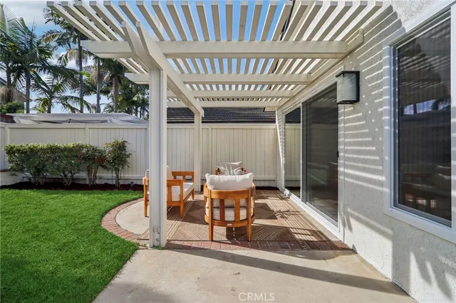 a view of a chair and table in the patio