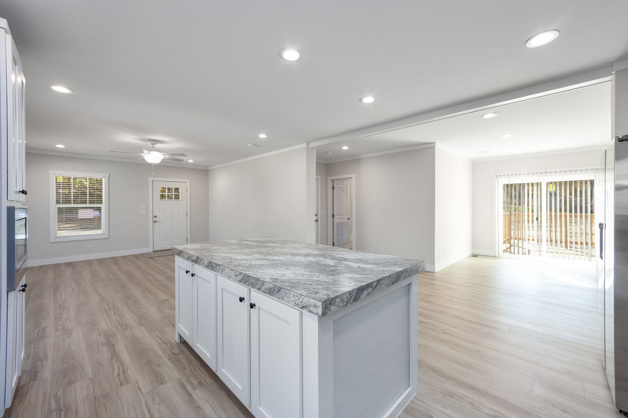 2127 North Royal Street Jackson, TN 38305 - Photo 7 of 24 a view of kitchen island a sink and wooden floor