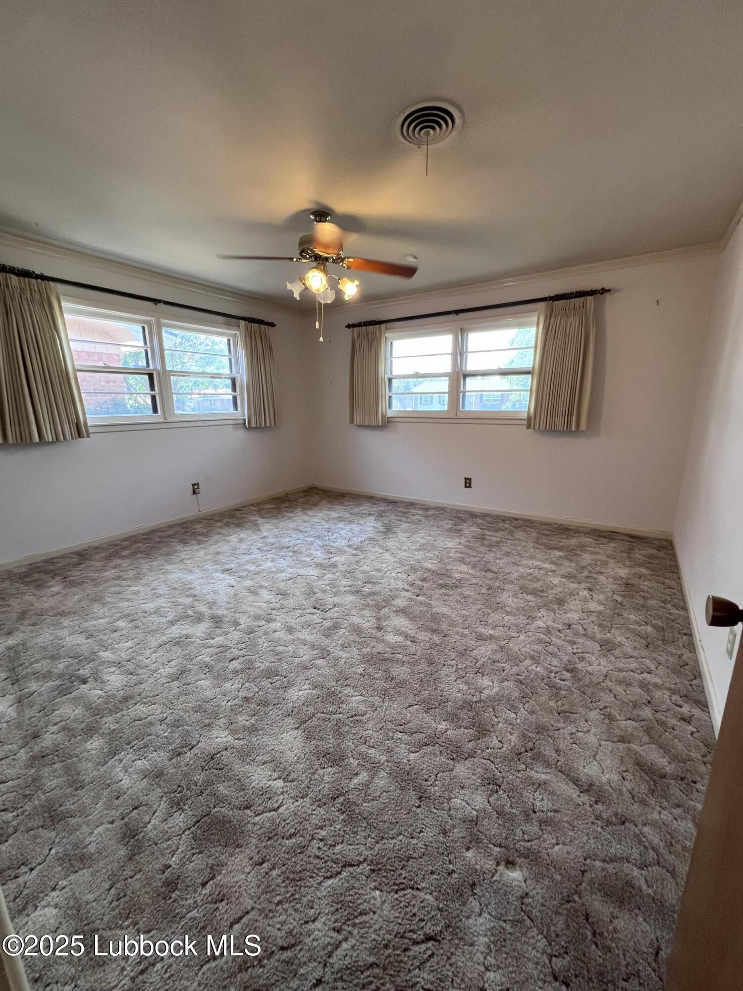 2304 54th Street Lubbock, TX 79412 - Photo 15 of 18 a view of an empty room and window