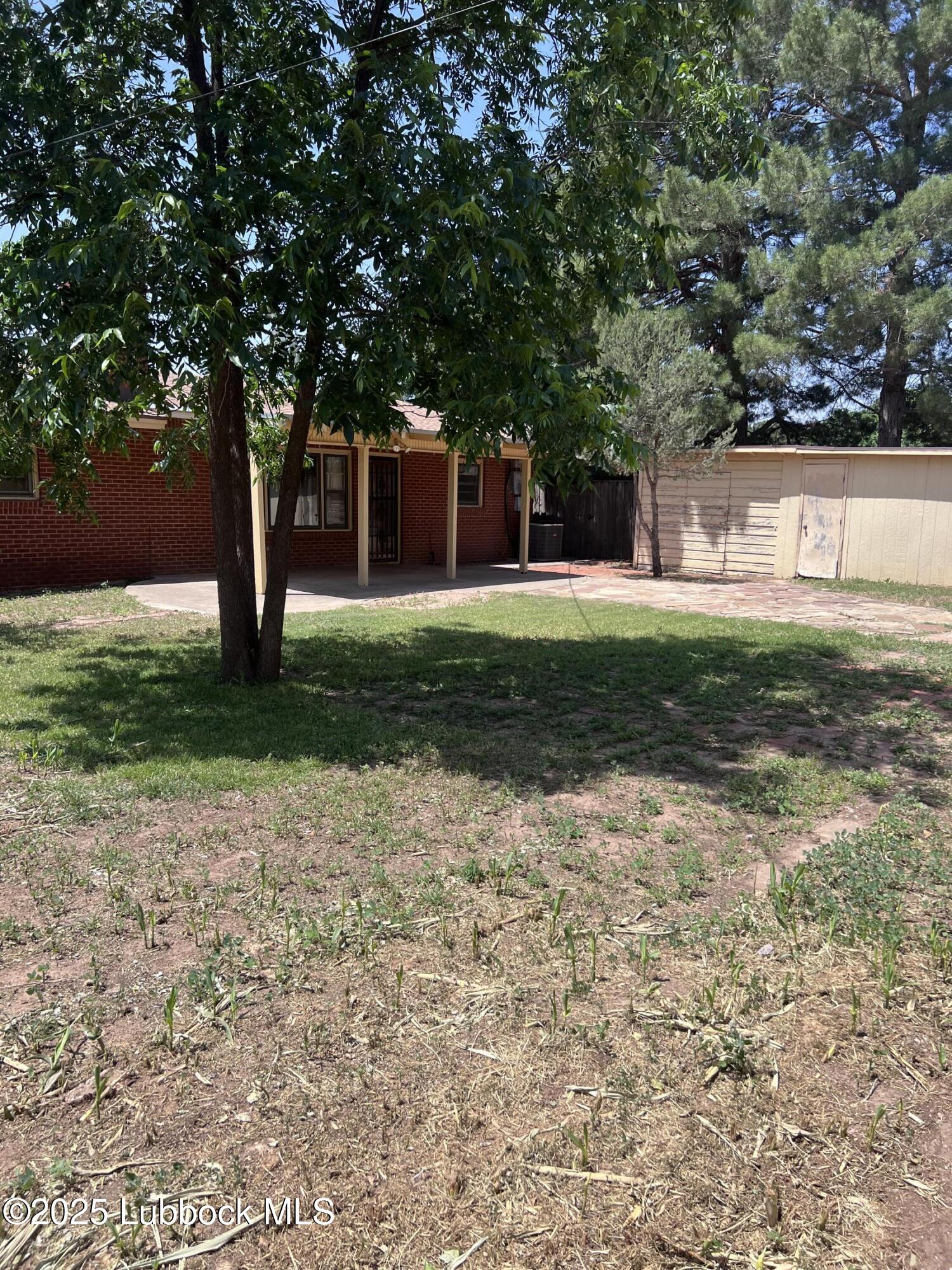 2304 54th Street Lubbock, TX 79412 - Photo 18 of 18 a front view of a house with a yard
