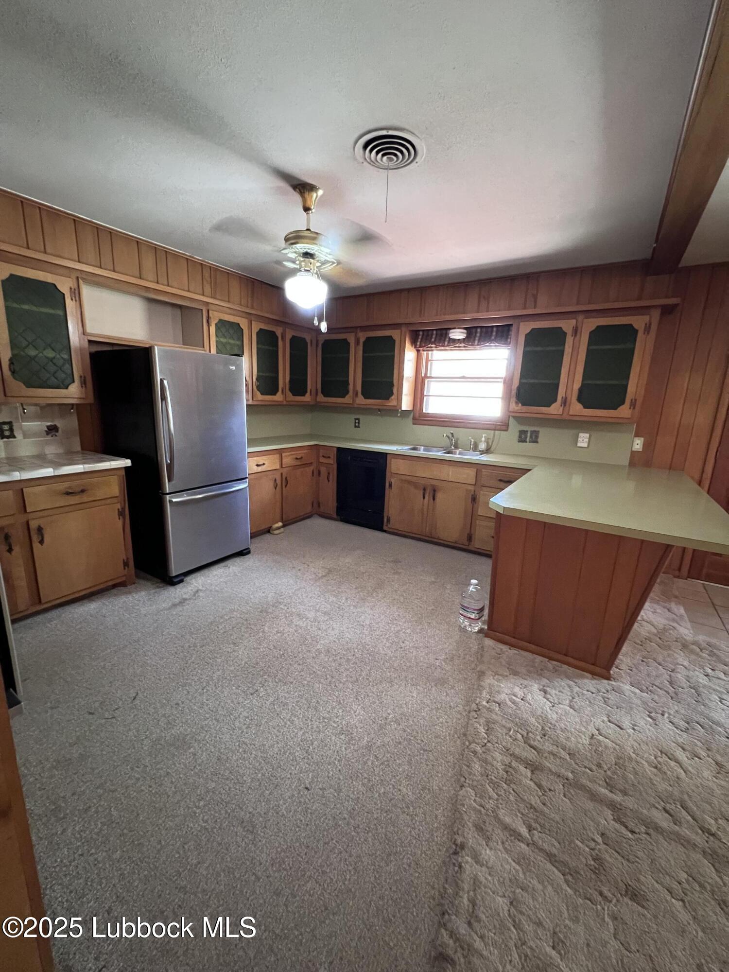 2304 54th Street Lubbock, TX 79412 - Photo 3 of 18 a living room with furniture and a flat screen tv