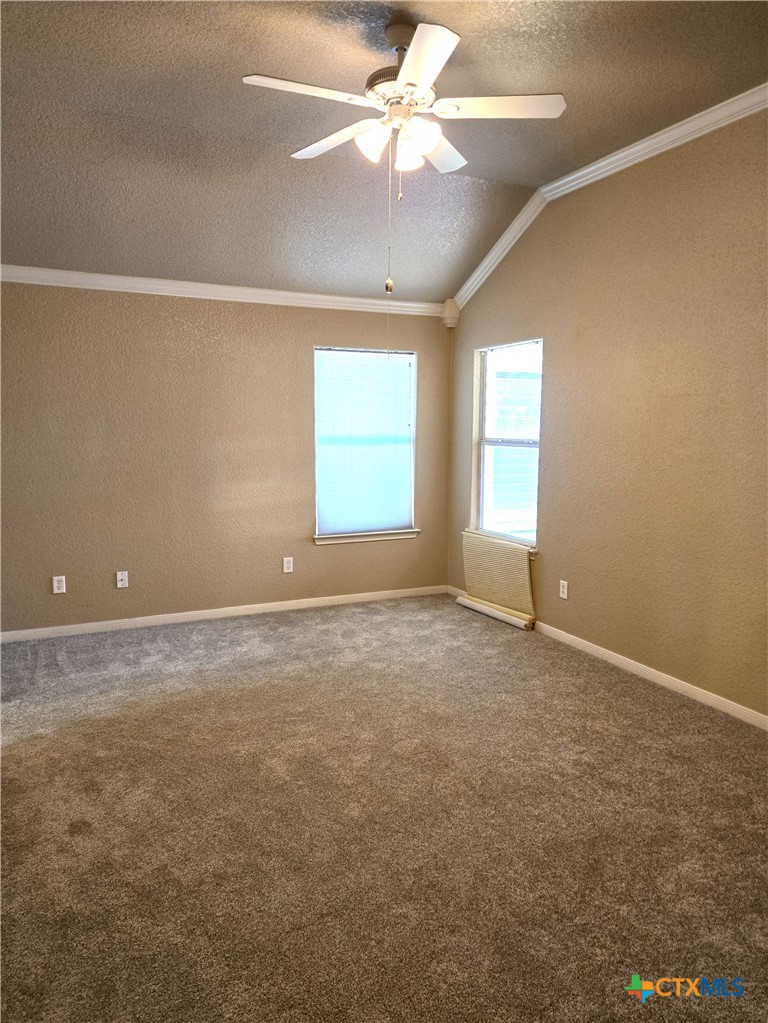 6308 Roxbury Avenue Temple, TX 76502 - Photo 14 of 26 an empty room with a window and a ceiling fan