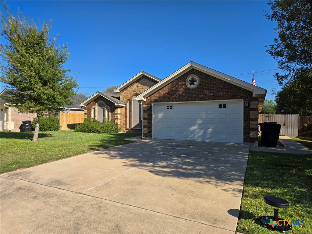6308 Roxbury Avenue Temple, TX 76502 - Photo 2 of 26 a front view of a house with a yard