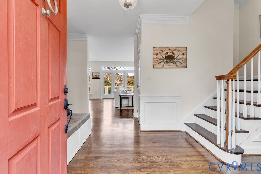 5337 Irvington Road White Stone, VA 22578 - Photo 16 of 53 Large foyer with ornamental molding and dark wood