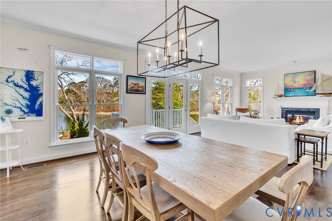 5337 Irvington Road White Stone, VA 22578 - Photo 29 of 53 Dining space with hanging lights, and dark wood-st