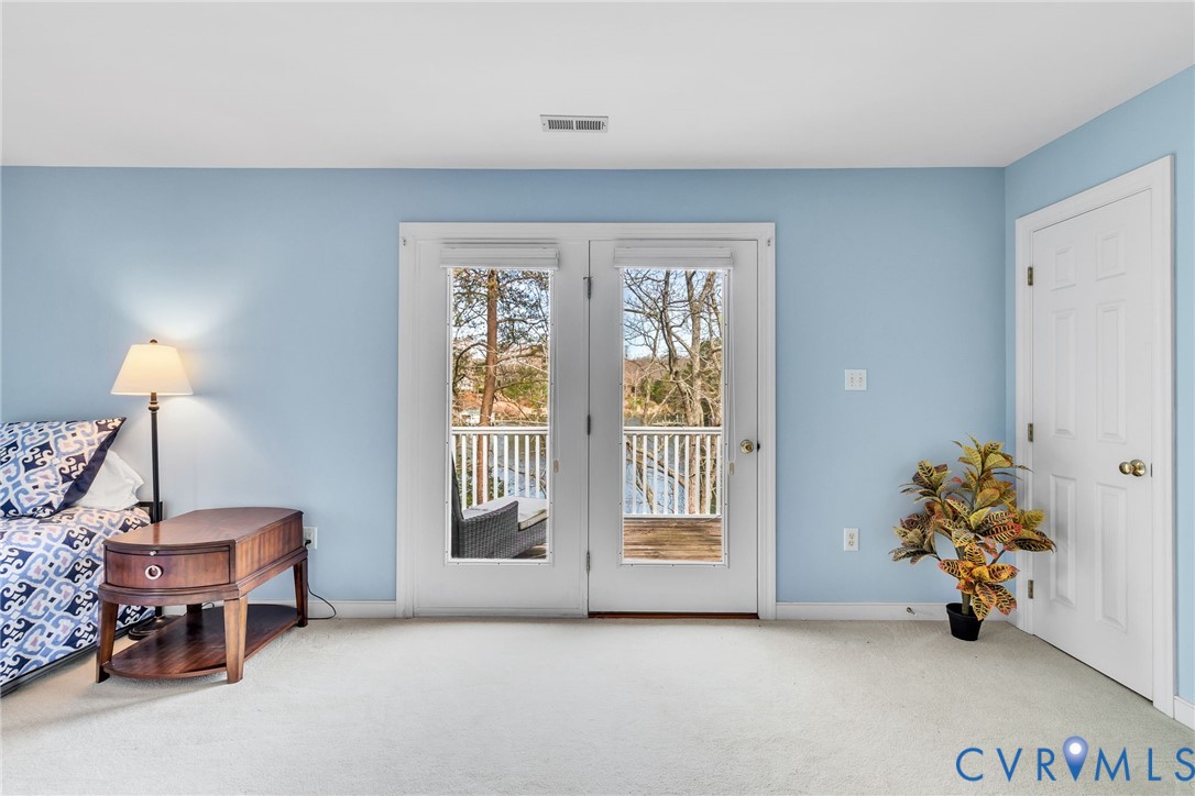 5337 Irvington Road White Stone, VA 22578 - Photo 32 of 53 Bedroom featuring light colored carpet, ceiling fa