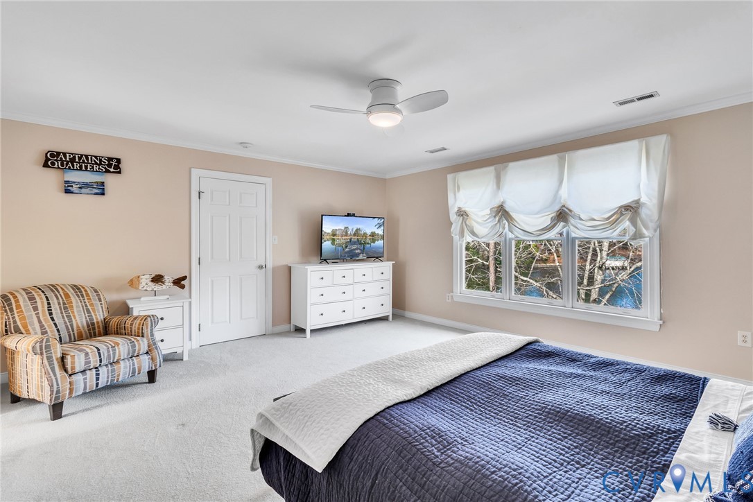 5337 Irvington Road White Stone, VA 22578 - Photo 37 of 53 Bedroom featuring light carpet, ceiling fan, and e