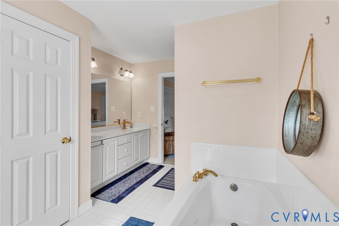5337 Irvington Road White Stone, VA 22578 - Photo 38 of 53 Bathroom with double vanity and a bath