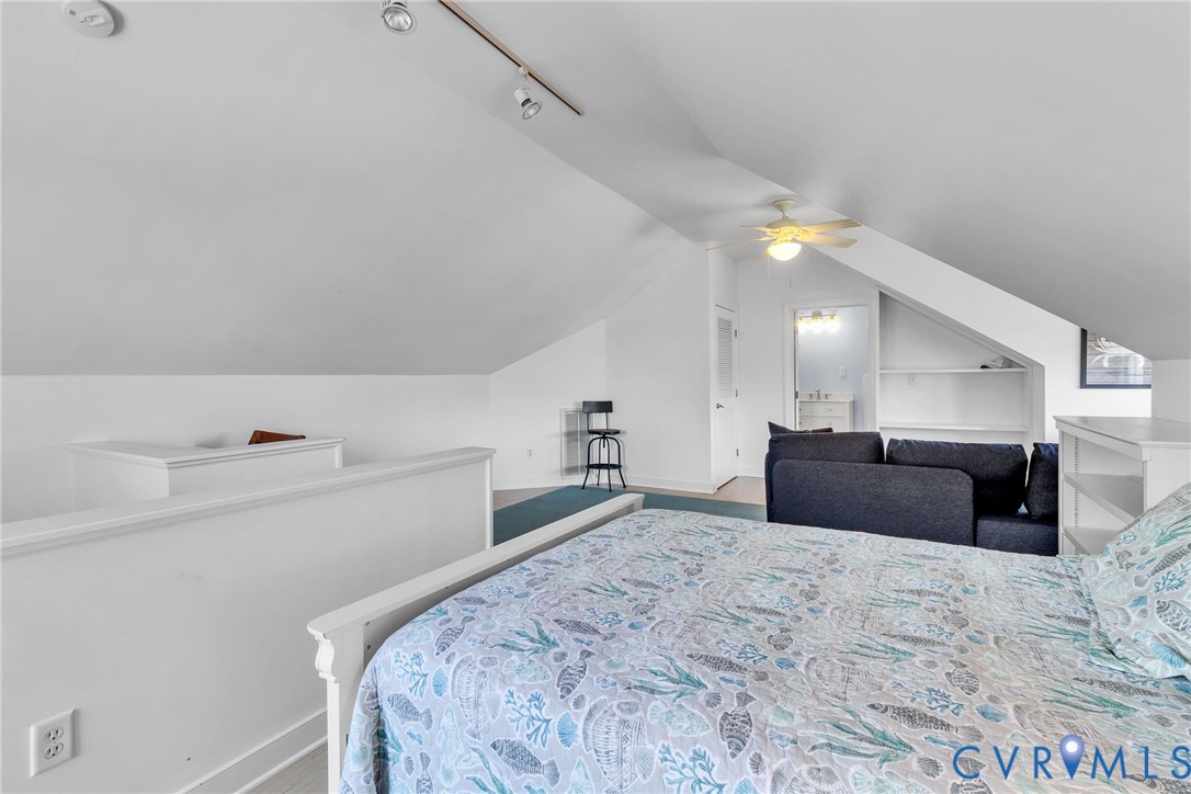 5337 Irvington Road White Stone, VA 22578 - Photo 45 of 53 Bedroom with lofted ceiling, a ceiling fan, rail l